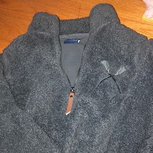 Sherpa quarter zip with lacrosse stick logo